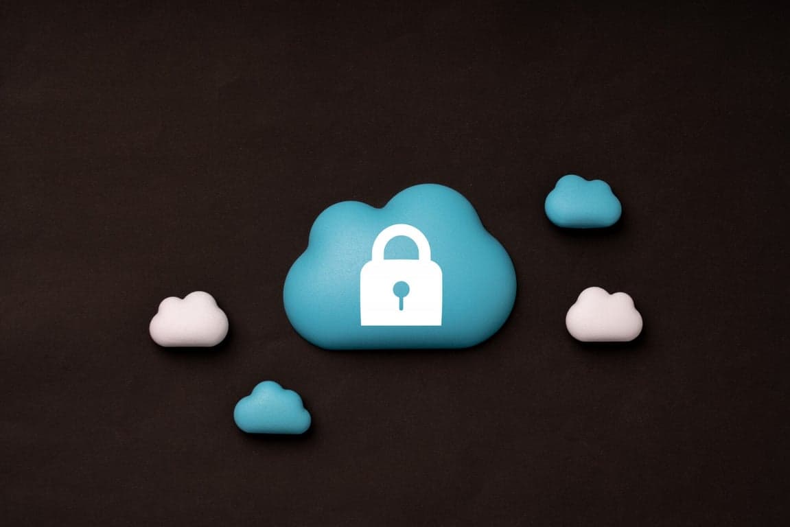 Abstract visual representing cloud security with a prominent lock shielding data in the cloud.