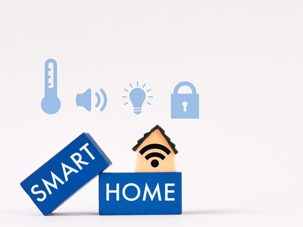 Conceptual image illustrating smart home devices facing cybersecurity risks like spying and hacking.